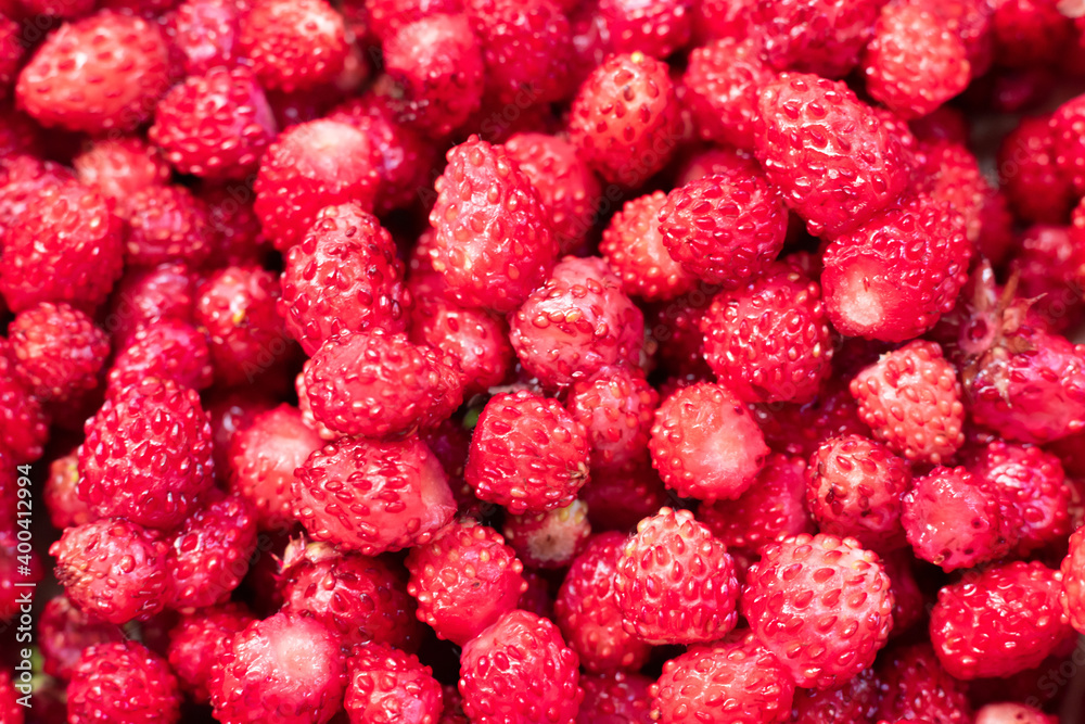 Lot of forest appetizing and tasty strawberries as pattern. Summer season berries Lot of forest appetizing and tasty strawberries as pattern. Summer season berries