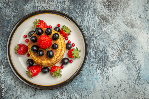 top view delicious pancakes with fruits and berries on dark desk cake fruit dessert