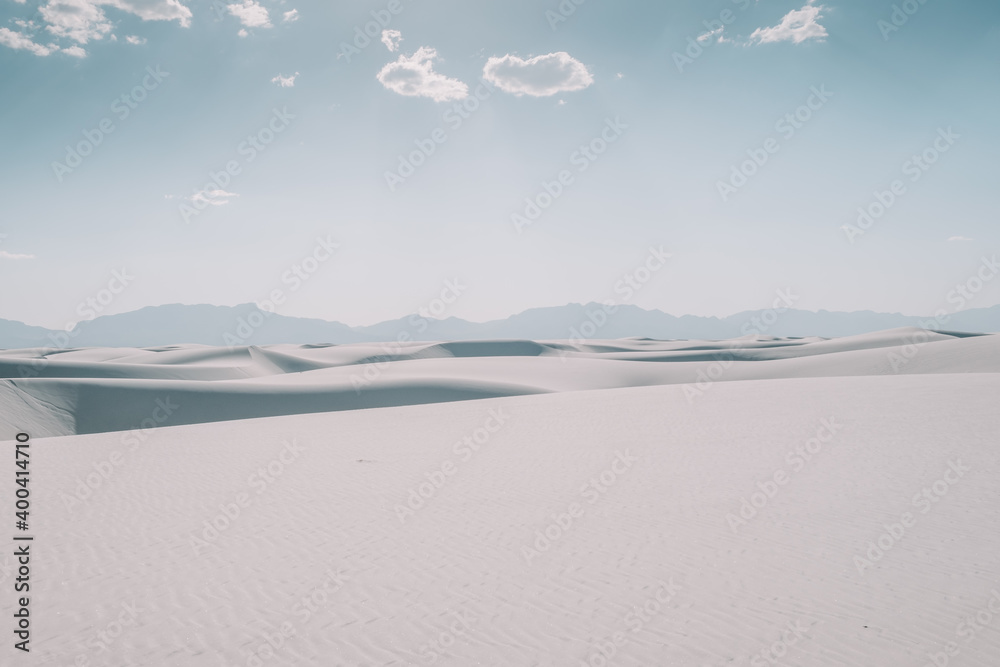 Desert sand dune landscape of White Sands National Park in New Mexico, USA during a clear, sunny day. White sand dunes. Desert sand dune landscape of White Sands National Park in New Mexico, USA during a clear, sunny day. White sand dunes.