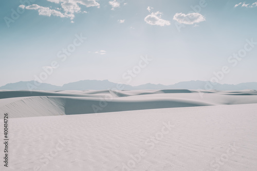 Fototapeta Naklejka Na Ścianę i Meble -  Desert sand dune landscape of White Sands National Park in New Mexico, USA during a clear, sunny day. White sand dunes.   