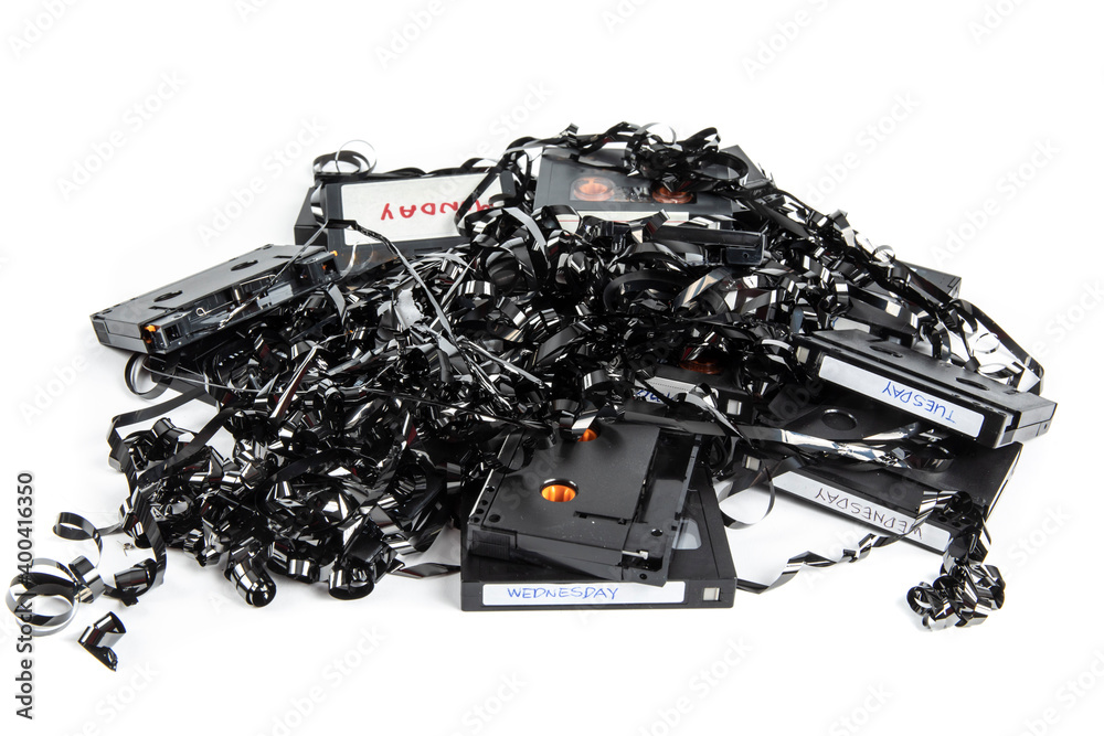 a messy pile of computer digital backup tape cartridge destroyed before