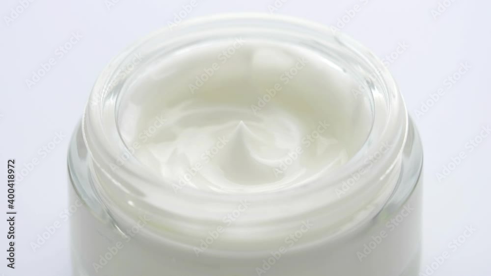 Cream white background texture. Cosmetics cream with rotate. Cream white background texture. Cosmetics cream with rotate.