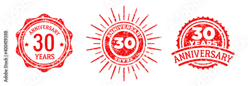 A group of 30 years anniversary logos drawn in the form of stamps, red frames for celebration. Grunge rubber stamp texture. Holiday stamps. Collection of postage stamps. Vector round stamps