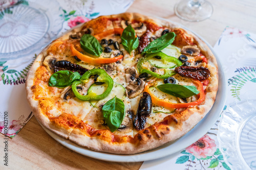 vegetable pizza on wooden table