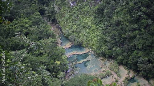 selva de semuc champey  con rio en medio de color azul  photo