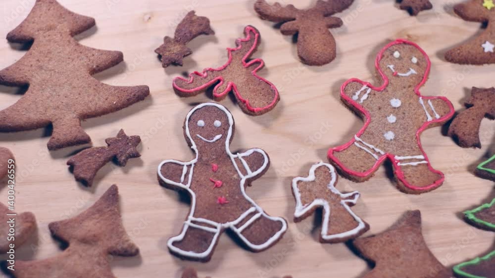 Person preparing gingerbread cookies for Christmas. Cutting starts, reindeers, christmas trees and gingerbread men. Person preparing gingerbread cookies for Christmas. Cutting starts, reindeers, christmas trees and gingerbread men.