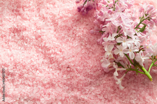 lilac bath salt and some fresh lilac flowers in pink color