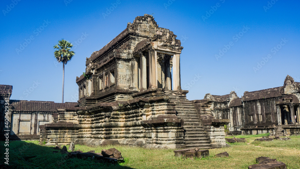Siem Reap, Cambodia - December 2015: Ruins of Angkor Wat. Angkor Wat is the largest religious monument in the world. Siem Reap, Cambodia - December 2015: Ruins of Angkor Wat. Angkor Wat is the largest religious monument in the world.