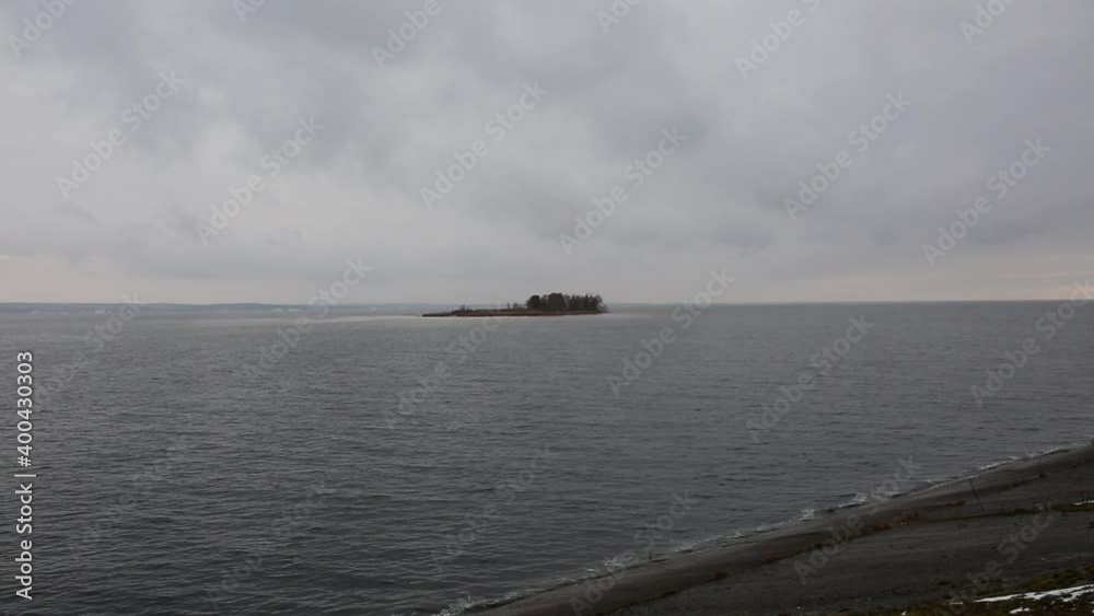 A small island on which the trees grow and birds fly. Autumn