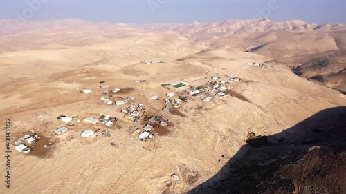 Bedouin camp Isolated in Judaean desert Aerial view
Drone footage over Bedouin outpost Close to Israeli City Maale Adumim Aerial, Israel
 photo