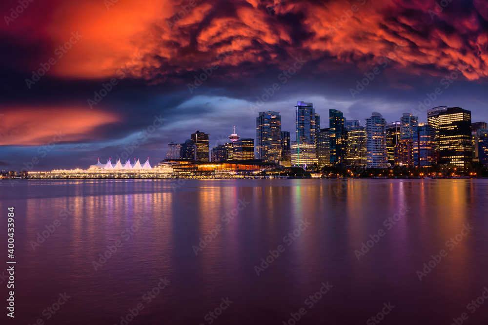 View of Coal Harbour in Downtown Vancouver, British Columbia, Canada, after Sunset. Modern City Skyline during Night. Dramatic Sky Artistic Render