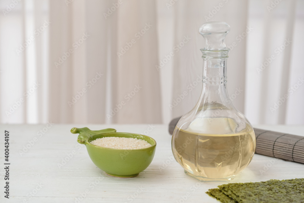 Composition with rice vinegar on table