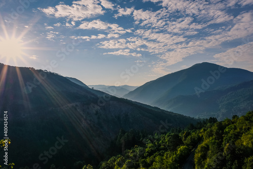 Sun rising in Smolikas mountain. View of surrounding forest and summits from Pades village.
