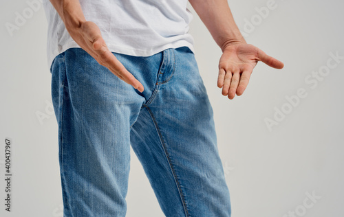 man showing negative gesture with hand problems with genitals © SHOTPRIME STUDIO