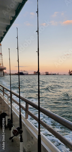 Obraz na plátně Fishing rods are ready for deep sea fishing on the Gulf of Mexico