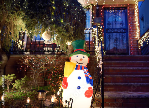 New York, USA - December 26, 2019: A street, house and porch decorated for Christmas and New Year in the Dyker Heights neighborhood. photo