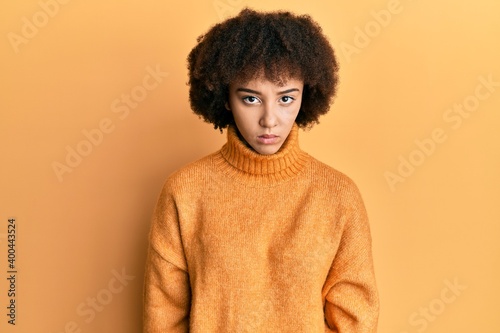 Young hispanic girl wearing wool winter sweater skeptic and nervous, frowning upset because of problem. negative person. © Krakenimages.com