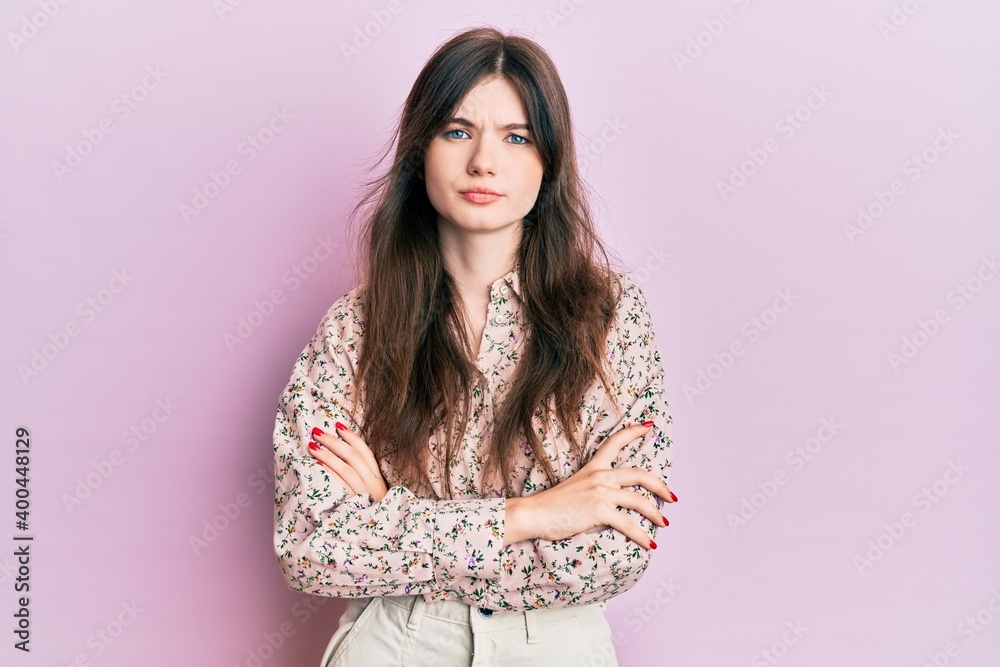 Young beautiful caucasian girl wearing elegant clothes skeptic and nervous, disapproving expression on face with crossed arms. negative person.