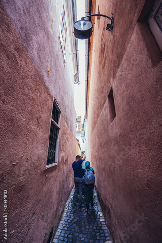 Famous narrow street Strada Sforii - Rope or String Street in Brasov city, Romania photo