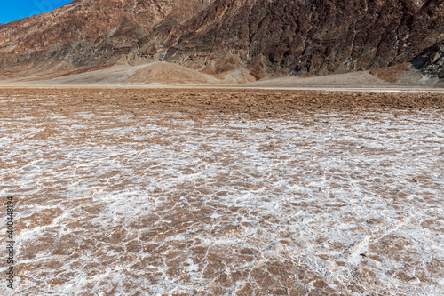 Mountains rise above the salt flats at Badwater Basin, Death Valley National Park, California, USA
