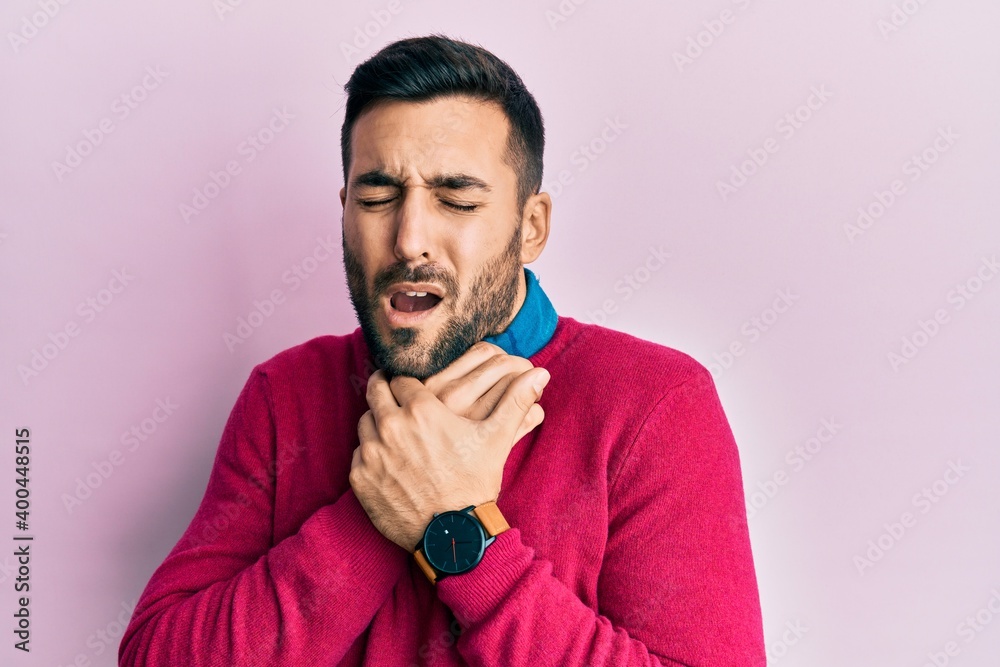 Young hispanic man wearing casual clothes shouting suffocate because painful strangle. health problem. asphyxiate and suicide concept. Young hispanic man wearing casual clothes shouting suffocate because painful strangle. health problem. asphyxiate and suicide concept.
