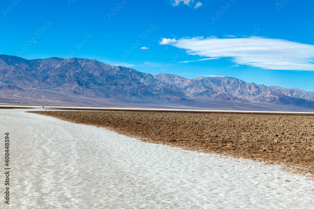 Hikers at Badwater Basin, Death Valley National Park, California, USA Hikers at Badwater Basin, Death Valley National Park, California, USA