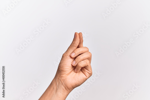 Hand of caucasian young man showing fingers over isolated white background holding blank space with thumb finger, business and advertising