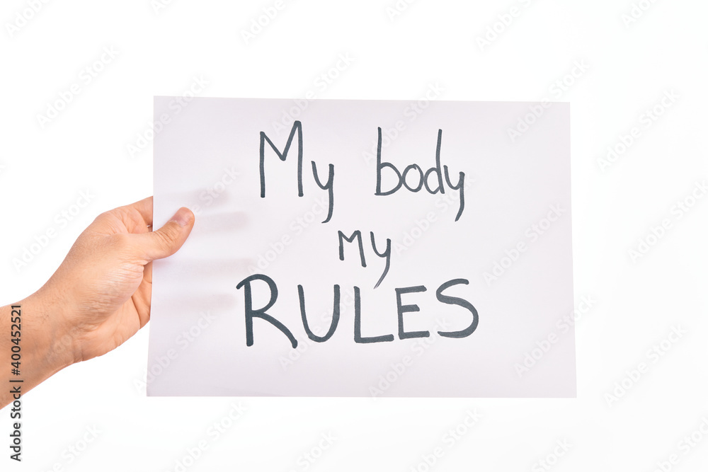 Cardboard banner with MY BODY MY RULES asking for body rights over isolated white background Cardboard banner with MY BODY MY RULES asking for body rights over isolated white background