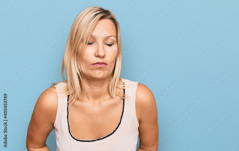 Middle age caucasian woman wearing casual clothes with hand on stomach because indigestion, painful illness feeling unwell. ache concept. Middle age caucasian woman wearing casual clothes with hand on stomach because indigestion, painful illness feeling unwell. ache concept.