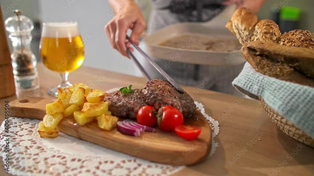 A close-up view of serving burgers in the kitchen