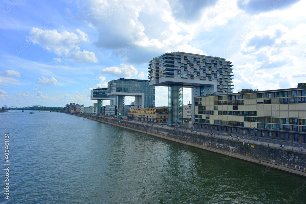 Cologne, Germany view over the river rhine to the crane buildings at the Rheinauhafen