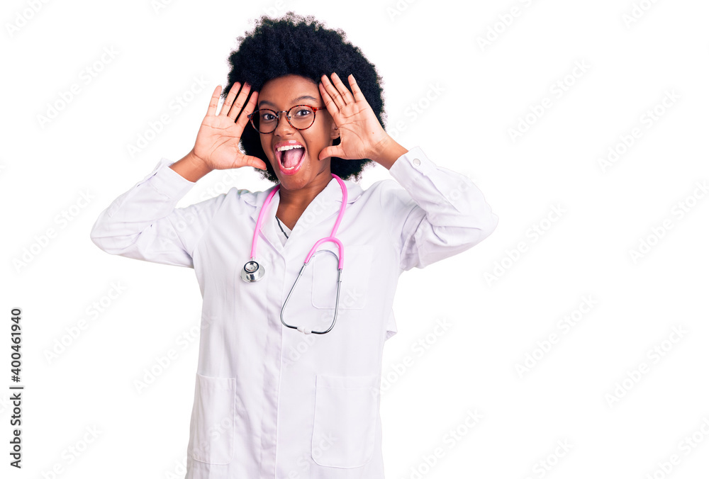 Young african american woman wearing doctor coat and stethoscope smiling cheerful playing peek a boo with hands showing face. surprised and exited Young african american woman wearing doctor coat and stethoscope smiling cheerful playing peek a boo with hands showing face. surprised and exited