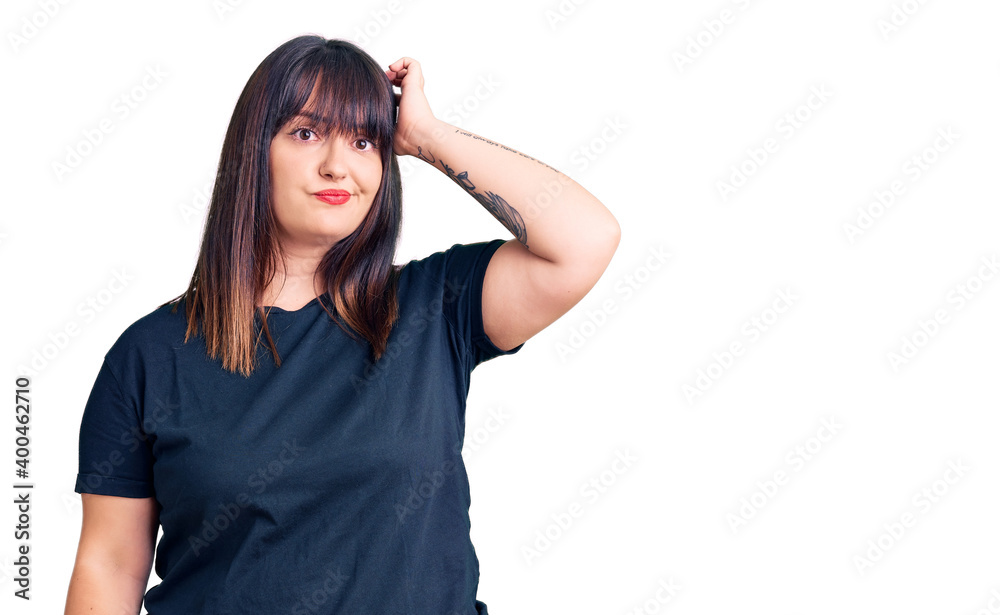 Young plus size woman wearing casual clothes confuse and wonder about question. uncertain with doubt, thinking with hand on head. pensive concept. Young plus size woman wearing casual clothes confuse and wonder about question. uncertain with doubt, thinking with hand on head. pensive concept.