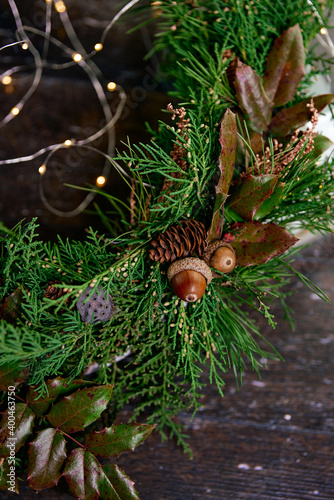 christmas wreath with green pine needles acorns