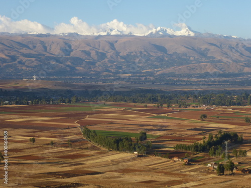 campo plano y al fondo un nevado. Cordillera de los andes - Valle del Mantaro photo