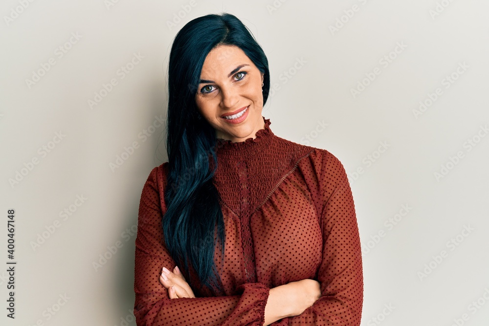 Fototapeta premium Young caucasian woman wearing casual clothes happy face smiling with crossed arms looking at the camera. positive person.