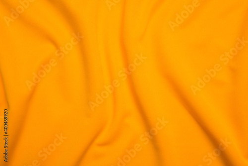 Yellow silk folded fabric background