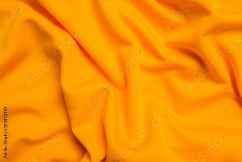 Yellow silk folded fabric background
