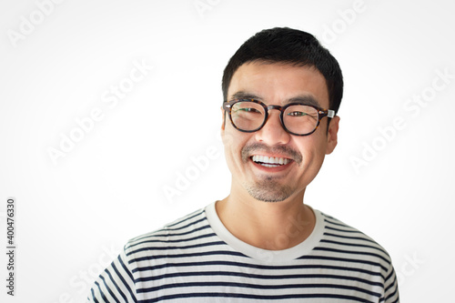 asian man portrait young male wear eye glasses smiling cheerful look thinking position with perfect clean skin posing on white background.fashion people life style concept © panitan