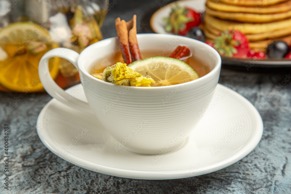 front view cup of tea with pancakes and fruits on the dark background morning breakfast food front view cup of tea with pancakes and fruits on the dark background morning breakfast food