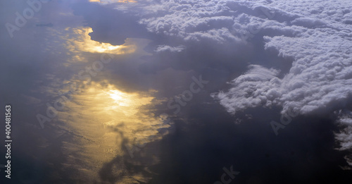 Aerial view of clouds and sky. Bird eye view from airplane window. Clouds panorama from airplane. Flight from Kiev to Sharm El Sheikh, Egypt.