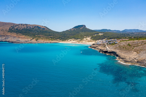 An aerial panorama of Cala Mesquida shoreline on Mallorca island in Spain