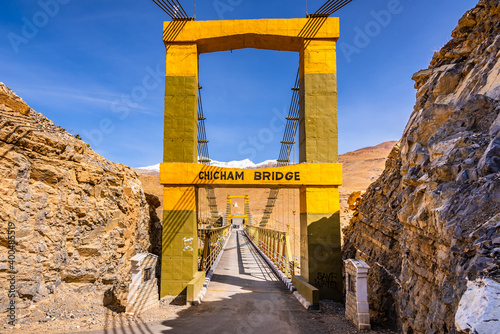 Chicham bridge is suspension stiffened steel truss bridge at altitude of 4145m over 1000 feet gorge of 'samba lamba' rivulet connecting Chicham & kibber villages in Spiti valley of Himachal Pradesh. photo