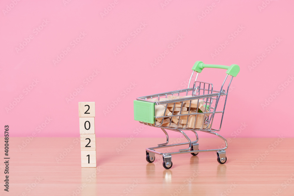 Happy new year 2021 with wood cube on pink background