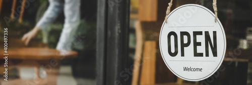 panoramic wide banner. coffee cafe shop text on vintage sign board hanging on glass door in cafe shop open after coronavirus quarantine in restaurant ready to service, small business owner concept
