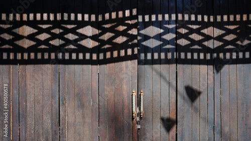  Retro Thailand wood door style.Open work pattern shadow on wood door 