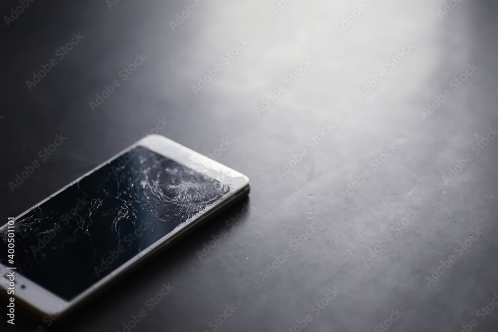 Smartphone with a broken touch screen. Mobile phone is broken. The phone crashed. Replacing broken glass on a cell phone. Smartphone repair. Smartphone with a broken touch screen. Mobile phone is broken. The phone crashed. Replacing broken glass on a cell phone. Smartphone repair.