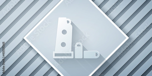 Paper cut Gun magazine and bullets icon isolated on grey background. Paper art style. Vector.