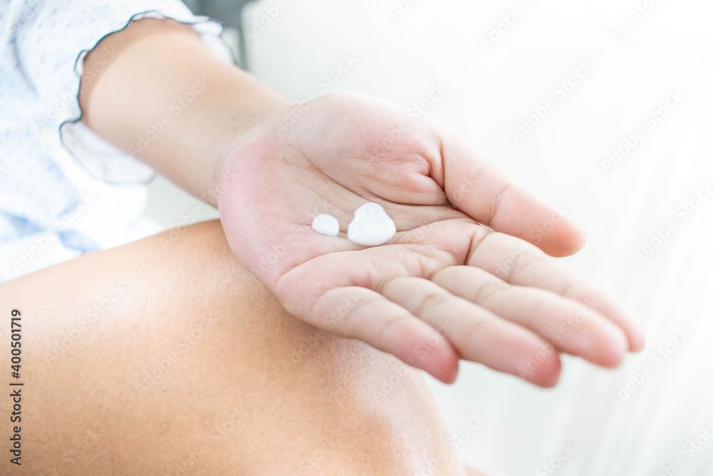 Woman squeezing cream on her hand Preparing to apply the skin Woman squeezing cream on her hand Preparing to apply the skin