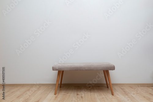 front view bench standing in front of white wall